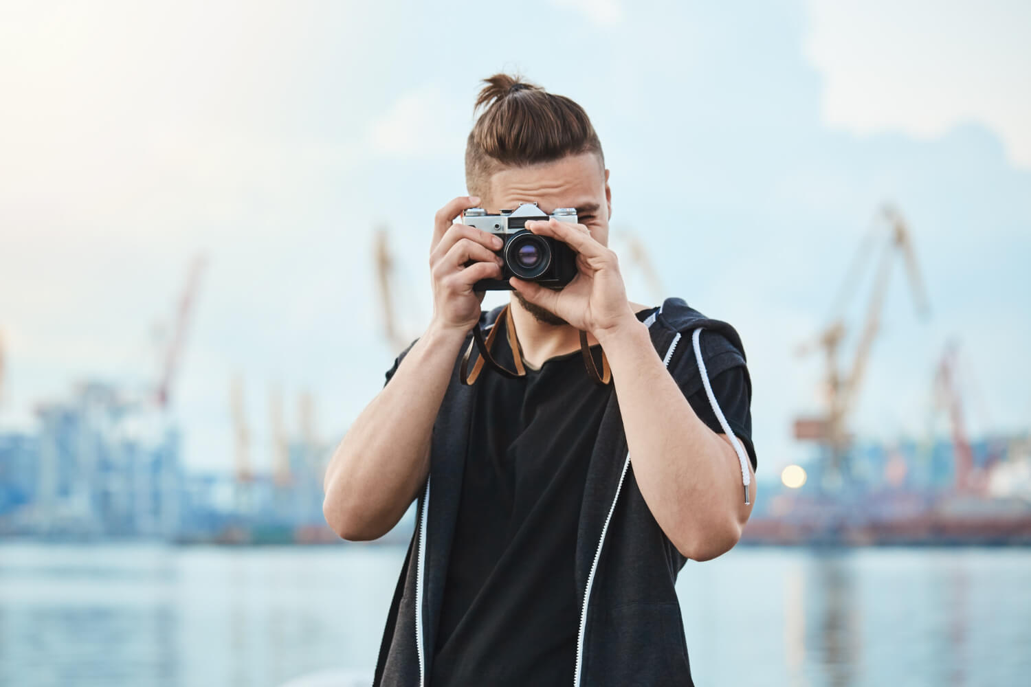 photographer-with-vintage-camera-taking-photos-near-sea-walking-around-city-picture-every-interesting-moment-1.jpg